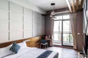 Giường trong phòng chung tại Toutsu Asami Guest House