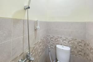 Koupelna v ubytování Nipa Guest House near Universitas Widyagama Mitra RedDoorz