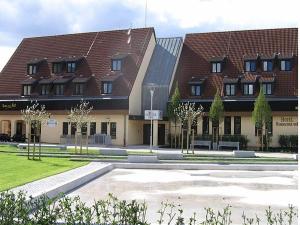 a large building with a courtyard in front of it at Hotel Hembacher Hof in Rednitzhembach