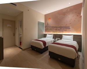 Postel nebo postele na pokoji v ubytování Hotel 88 Alun Alun Bandung By WH + 37 fotografií
