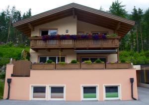 a house with a balcony on top of it at Apart Patricia in Längenfeld