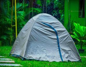 a tent sitting on the grass in a yard at Dandeli Eco VanaVasa by StayApart in Dandeli