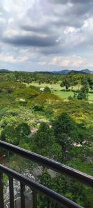 a view from a balcony of a golf course at Condo D'Savoy A Famosa Resort Melaka Homestay in Kampong Pulau Sebang