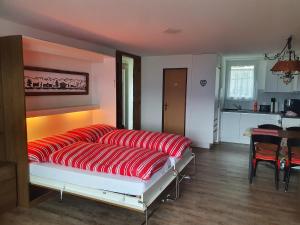 A bed or beds in a room at Elfe-apartments Studio for 2-4 guests with balcony and panorama view
