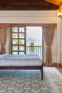 Katil atau katil-katil dalam bilik di amã Stays & Trails Makaibari Bungalow, Darjeeling