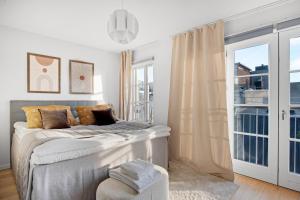 Postelja oz. postelje v sobi nastanitve Sanders Haven - Lovely Two-Bedroom Apartment In Historical Copenhagen