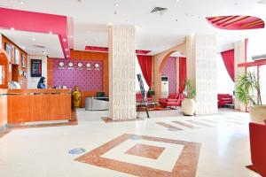 a lobby with a large letter k on the floor at OYO 118 Revira Hotel in Manama