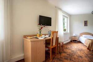 Posteľ alebo postele v izbe v ubytovaní Hotel Zamek