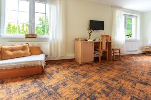 Televízia a/alebo spoločenská miestnosť v ubytovaní Hotel Zamek