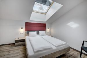 Postel nebo postele na pokoji v ubytování LoriVita Residenz Saalbach