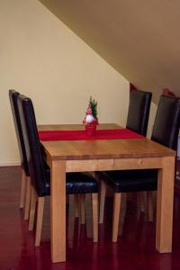 a wooden table with a christmas tree on top of it at Kandava apartment in Kandava