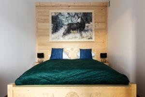 Posteľ alebo postele v izbe v ubytovaní Apartamenty Parzenica Zakopane