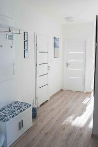 En eller flere senger på et rom på Apartament HAMPTONS Gdynia