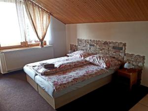 A bed or beds in a room at Privat Mrzkan