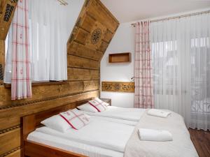 Posteľ alebo postele v izbe v ubytovaní Willa Pod Reglami Małe Ciche Sauna & Jacuzzi