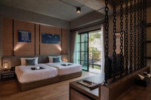 سرير أو أسرّة في غرفة في Siripanna Villa Resort & Spa Chiang Mai -SHA Extra Plus