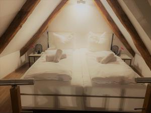 
Ein Bett oder Betten in einem Zimmer der Unterkunft Münster Altstadttraum
