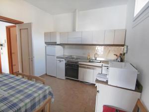 A kitchen or kitchenette at Apartment Lungolago by Interhome