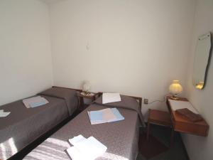A bed or beds in a room at Apartment Lungolago by Interhome