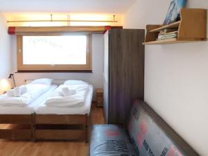 A bed or beds in a room at Apartment Rosablanche C25 by Interhome