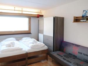 Apartment Rosablanche C25 by Interhome tesisinde bir odada yatak veya yataklar