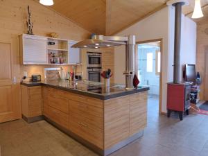 A kitchen or kitchenette at Chalet Heiti N- 17 by Interhome