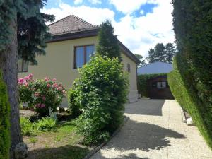 a house with a bush in front of it at Holiday Home 5- chemin de la Pralay by Interhome in Bellevue