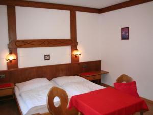 En eller flere senge i et værelse på Apartment Kaufmann by Interhome