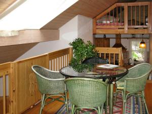 a dining room with a table and chairs at Holiday Home Sonnenschein by Interhome in Hornberg