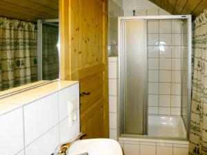 a bathroom with a shower and a toilet and a sink at Holiday Home Sonnenschein by Interhome in Hornberg