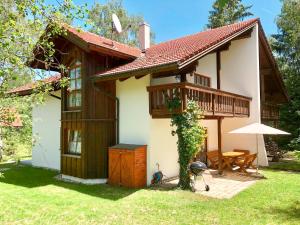 a small house with a deck and a grill at Holiday Home Birke by Interhome in Habischried