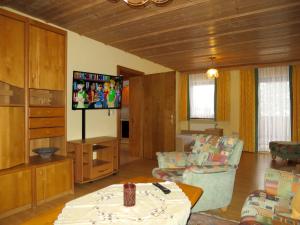 a living room with a couch and a tv at Apartment Irene by Interhome in Lohberg