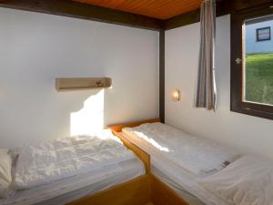 Giường trong phòng chung tại Holiday Home Jägerwiesen - WAH104 by Interhome