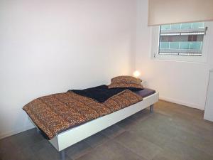Cama o camas de una habitación en Apartment Bletilla by Interhome