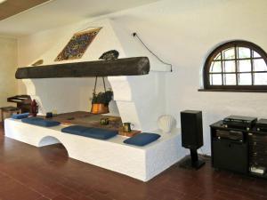 sala de estar con chimenea de piedra y altavoz en Holiday Home La Bertolina by Interhome, en Torrazzo