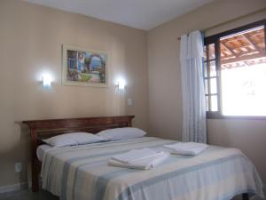 מיטה או מיטות בחדר ב-Pousada do Alferes