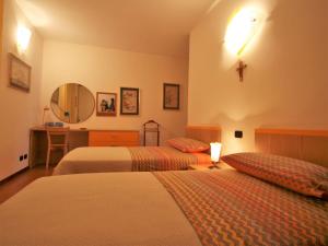 A bed or beds in a room at Apartment Franco by Interhome