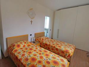 A bed or beds in a room at Apartment Franco by Interhome