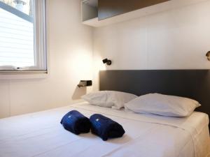Säng eller sängar i ett rum på Holiday Home Balatontourist Füred-1 by Interhome