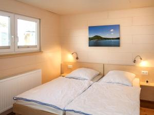 A bed or beds in a room at Holiday Home Erzeberg-4 by Interhome