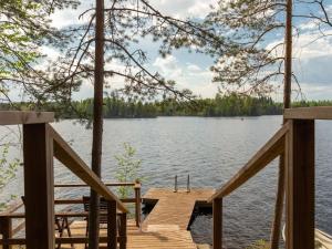 a view of a lake from a dock at Holiday Home Pohosniemi by Interhome in Huuhanaho