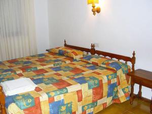 Łóżko lub łóżka w pokoju w obiekcie Apartment Les Dunes 1 dorm by Interhome