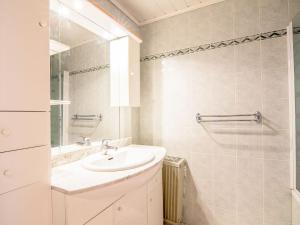 a white bathroom with a sink and a shower at Studio Le Sefcotel - Val Claret-21 by Interhome in Tignes +8 photos