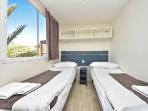 Posteľ alebo postele v izbe v ubytovaní Holiday Home Palma-3 by Interhome