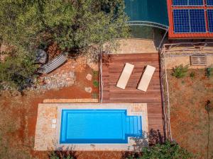 an overhead view of a swimming pool next to a house at Holiday Home Marijo by Interhome in Stari Grad