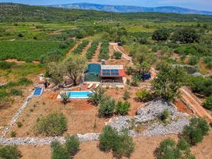 an aerial view of a farm house with a pool at Holiday Home Marijo by Interhome in Stari Grad