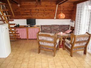 a living room with a couch and a table at Chalet Dehtáře by Interhome in Hluboká nad Vltavou