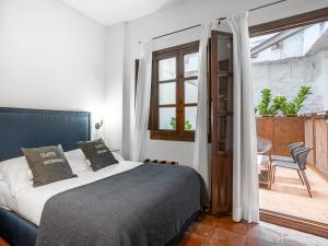 Postel nebo postele na pokoji v ubytování limehome Granada Calle Santa Ana