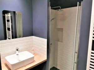a bathroom with a sink and a shower at Ancienne sous-prefecture in Les Sables-dʼOlonne +29 photos