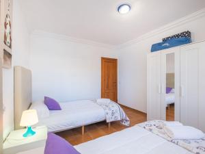 Postel nebo postele na pokoji v ubytování Villa Dofins Bahia Azul by Interhome